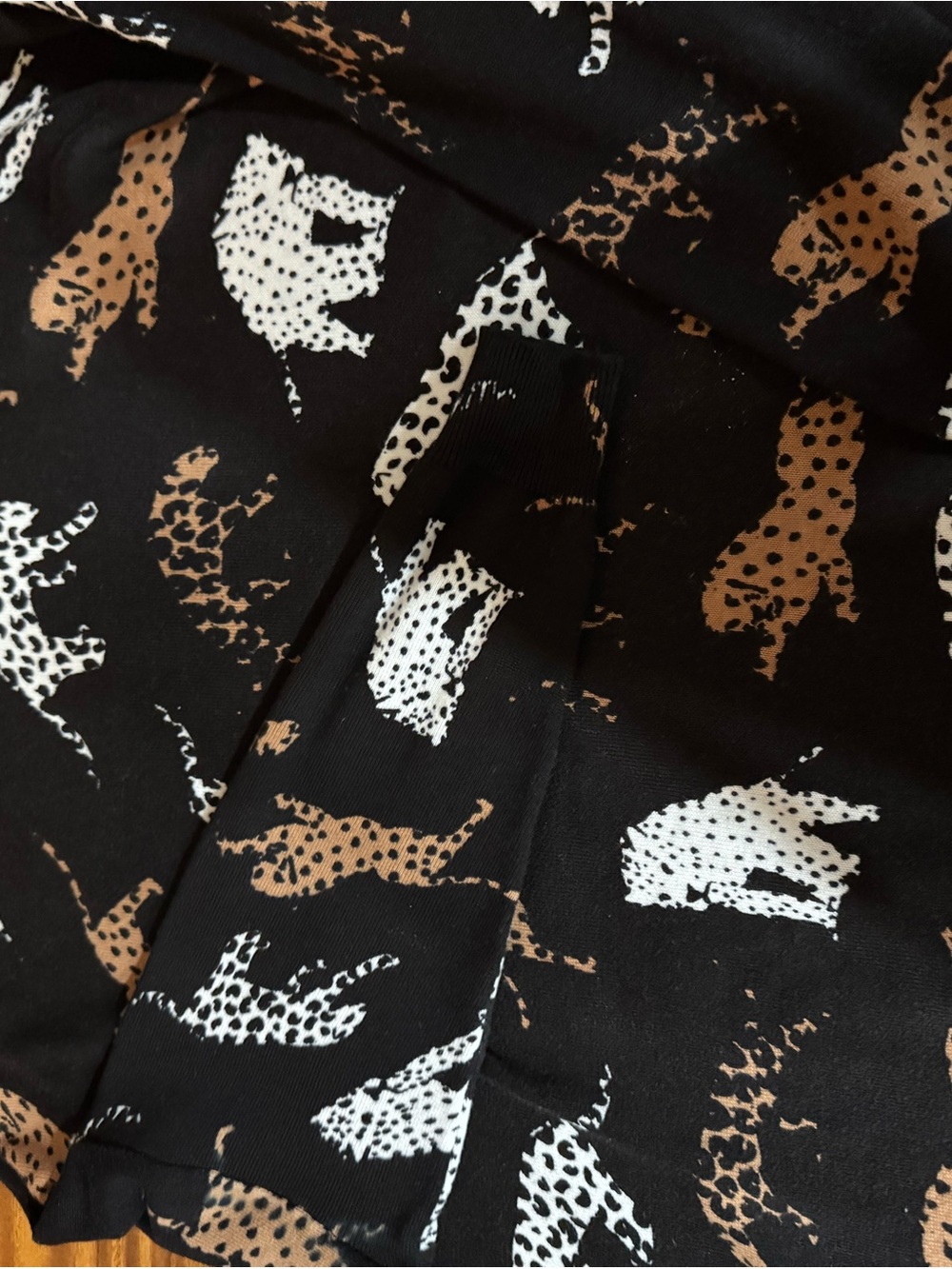 Black Animal Print light sweater with White and Tan Leopards